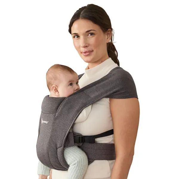 Parent wearing a baby in a gray Ergobaby Embrace soft knit carrier