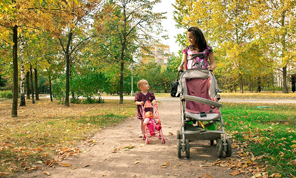 baby in umbrella stroller